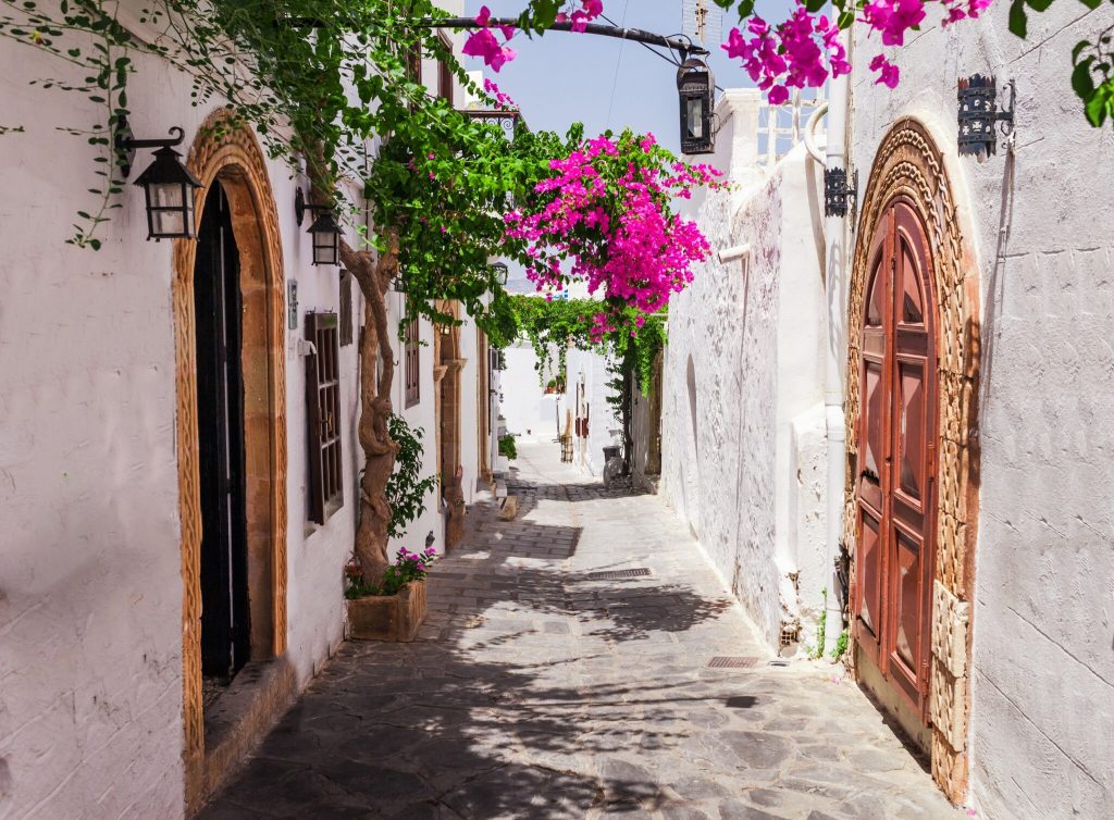 Narrow,Street,In,Lindos,Town,On,Rhodes,Island,,Dodecanese,,Greece.